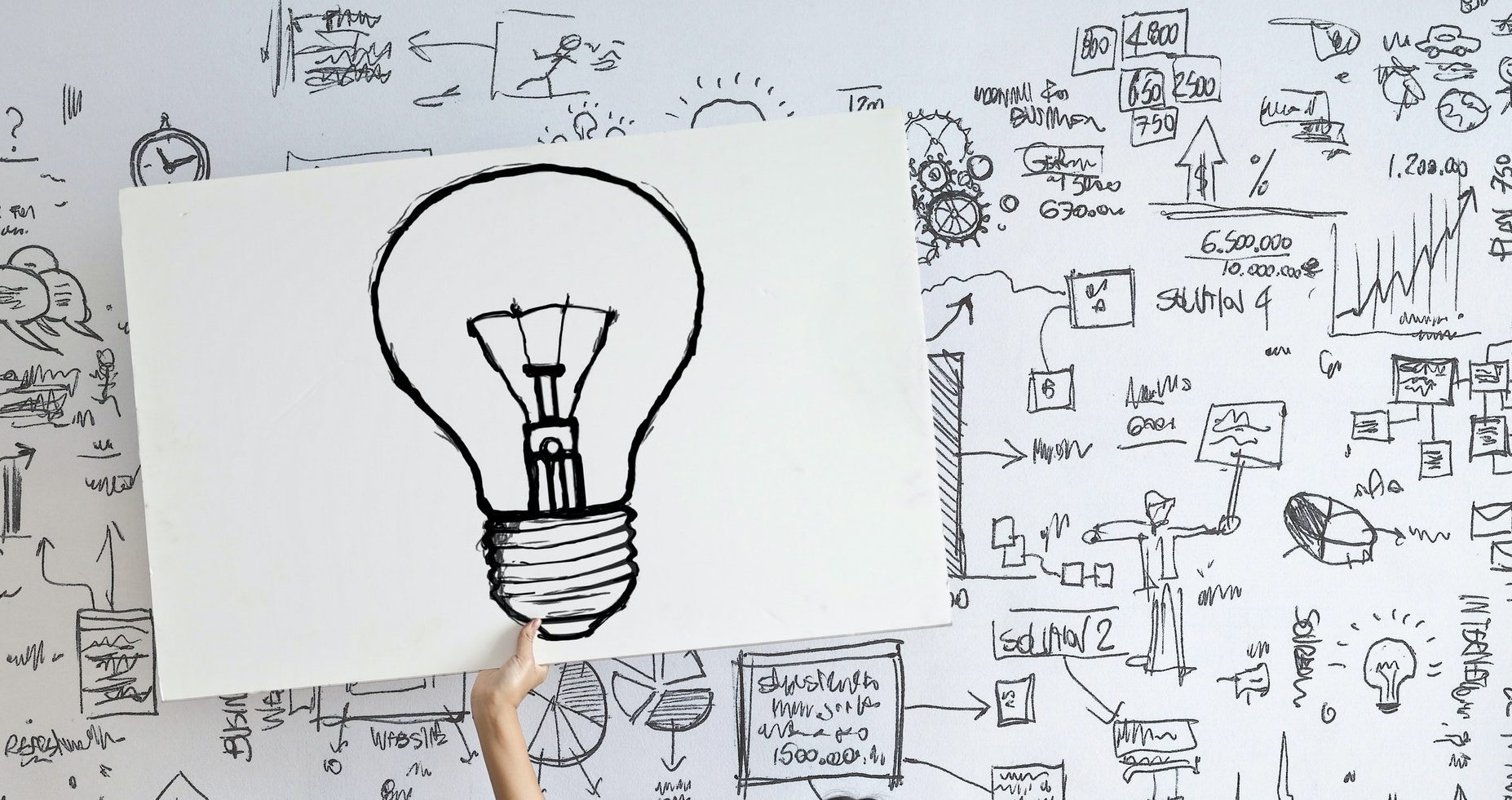 woman draw a light bulb in white board 3758105 e1585721999151